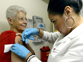 photo of nurse administering a flu shot