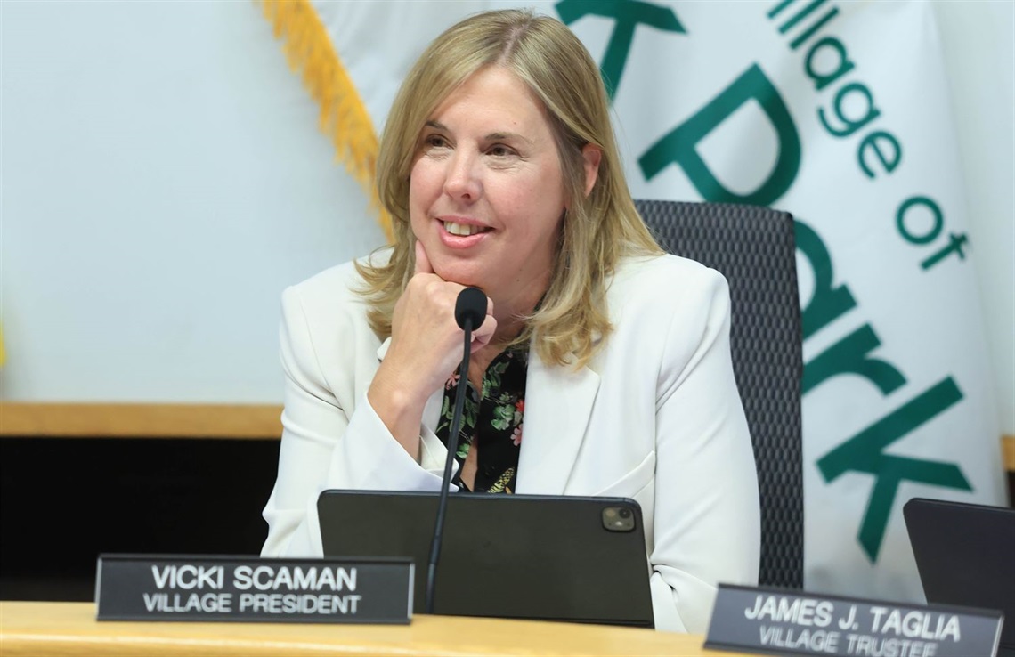Village President Vicki Scaman listens from her seat at a Board meeting