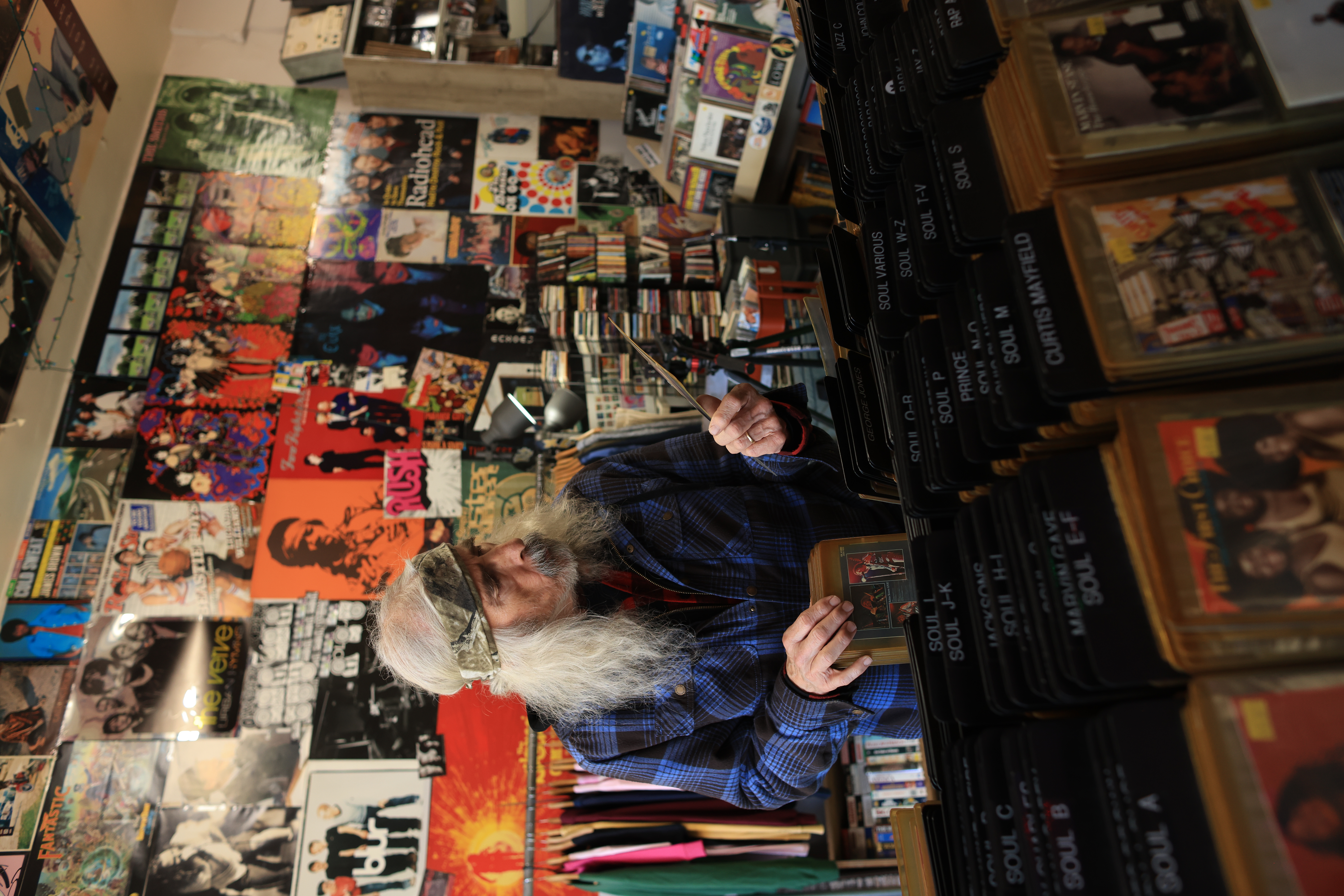 A shopper looks at the collection at Oak Park Records