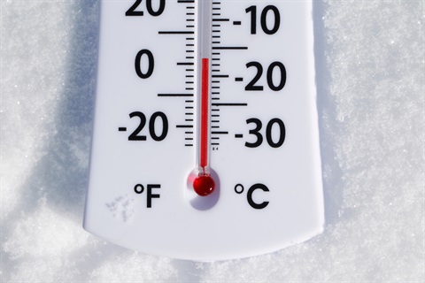Image of a thermometer displaying frigid temperature.
